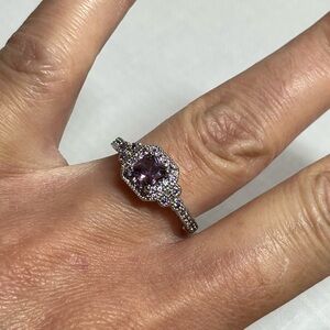 Silver tone ring with purple accents. Size 8